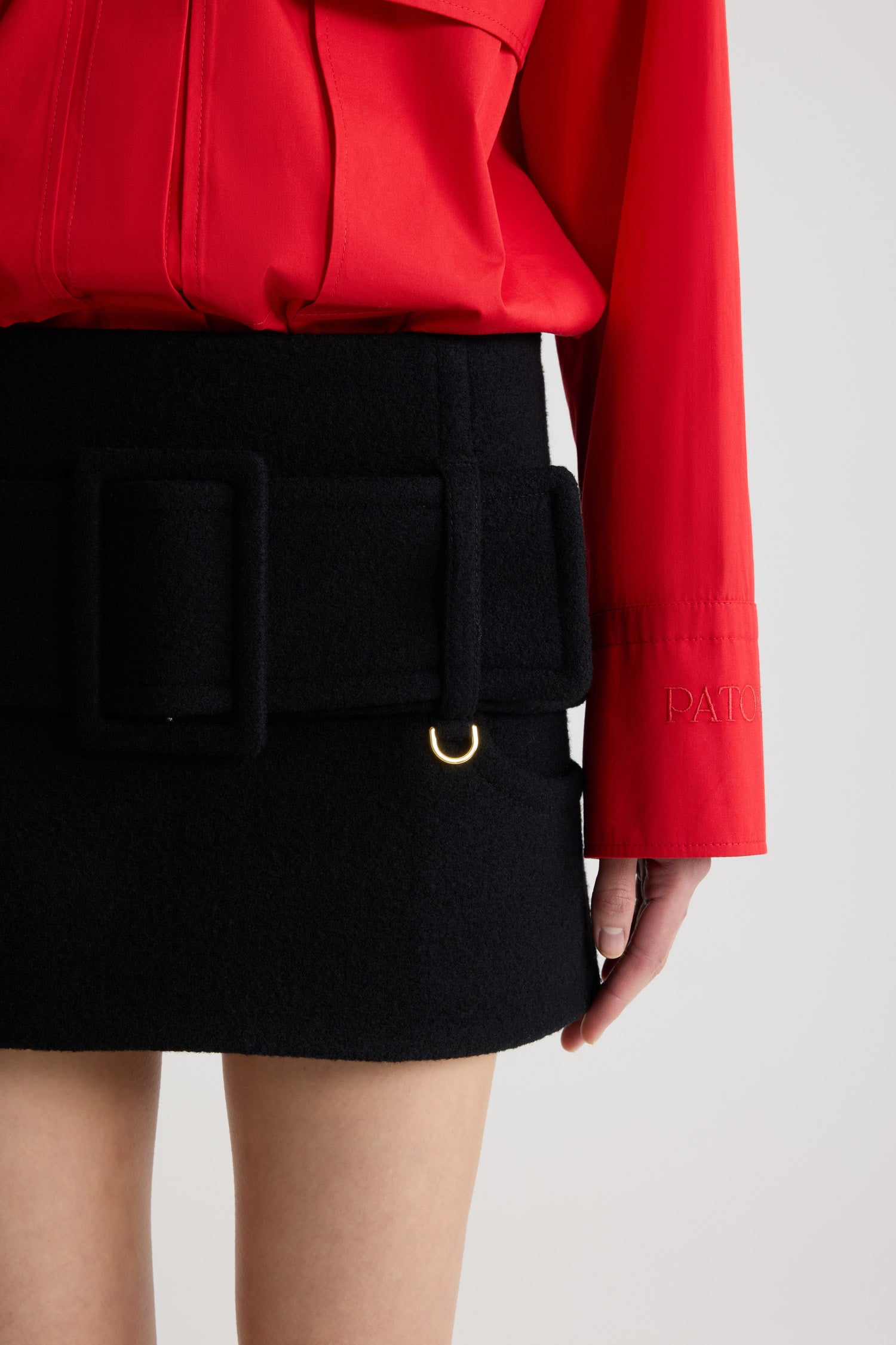 Patou SK099 mini jupe laine bouillie noire à ceinture