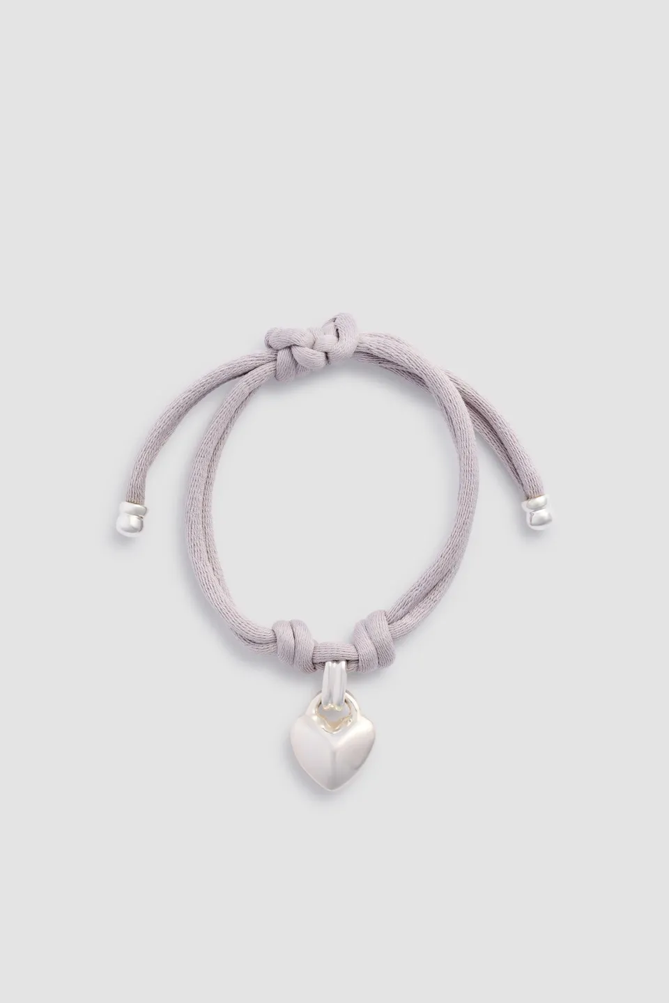 Patou JW153 bracelet pendentif coeur ruban argenté TU