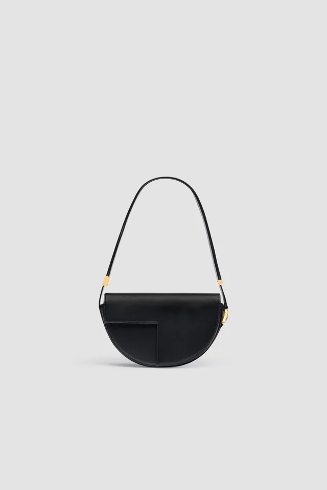 Patou Le Patou sac cuir noir demi-lune édition limitée