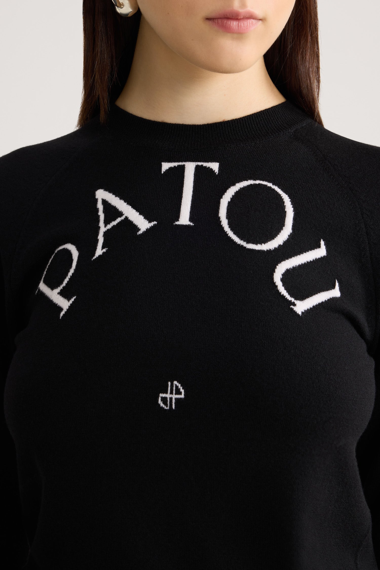 Patou KN110 pull laine Noire col rond logo jacquard