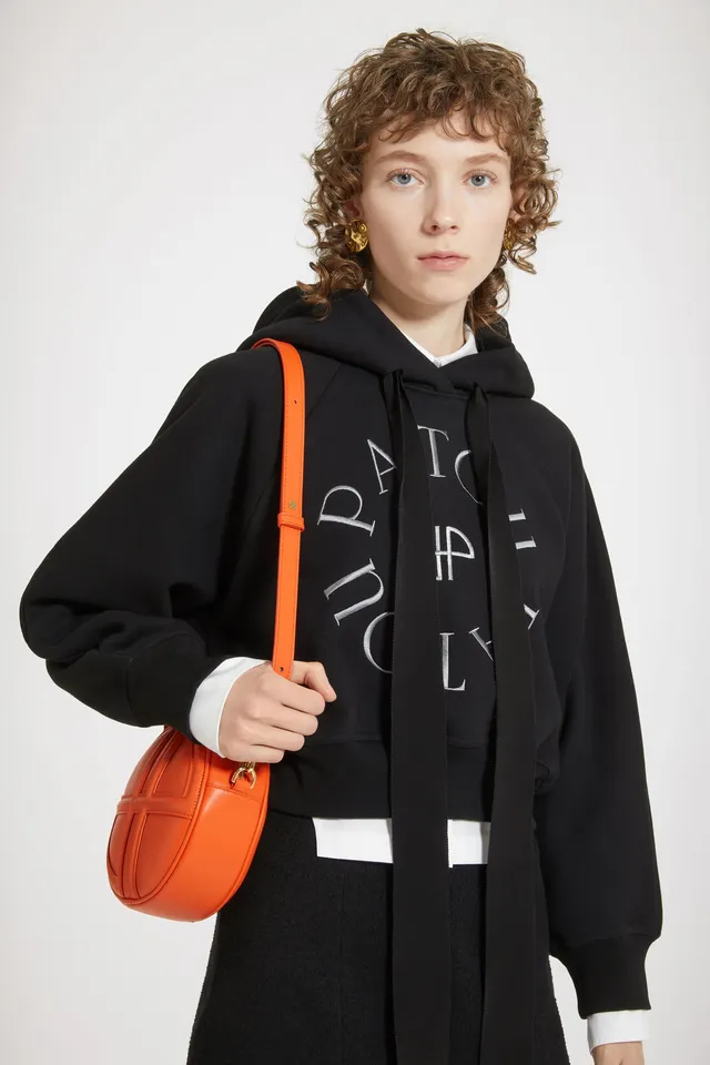 Patou JE069 Sweat capuche noir coton bio médaillon